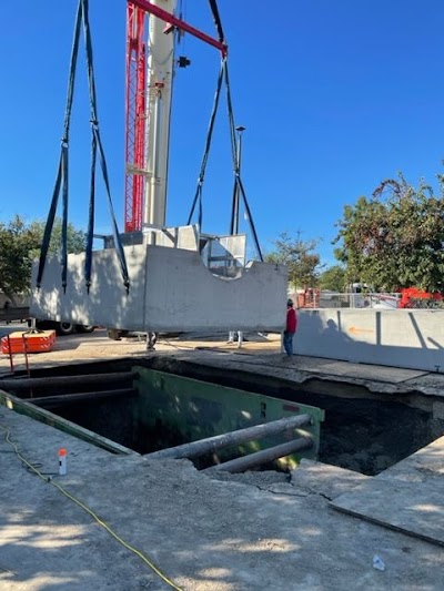 Crane setting precast concrete on a Tri-Group project
